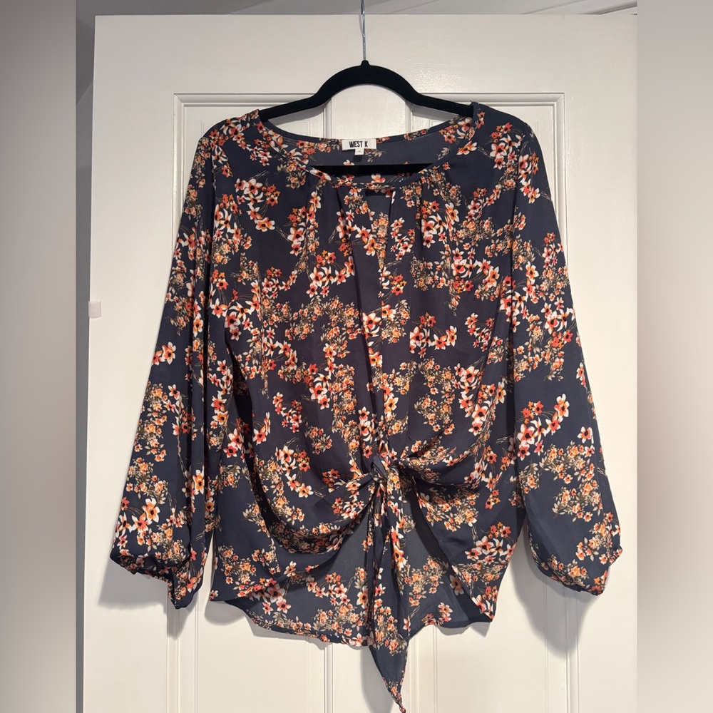 Blue with orange flowers blouse 
Three quarter sleeve shirt 
Ties in the front